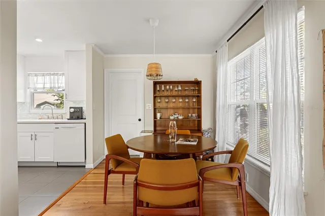 a view of a dining room with furniture and wooden floor