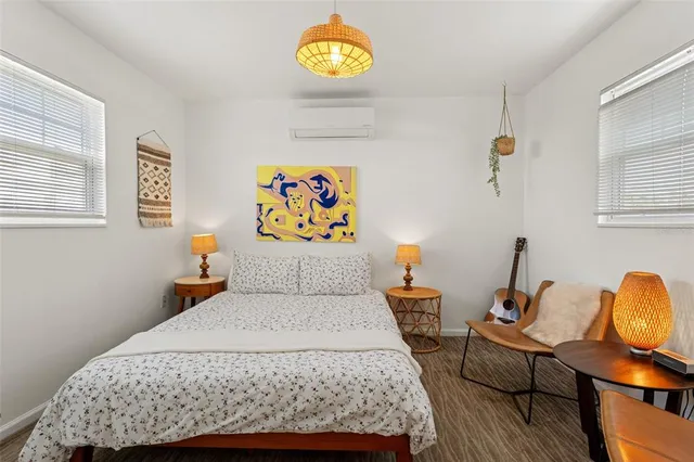 a bedroom with a bed and a couch