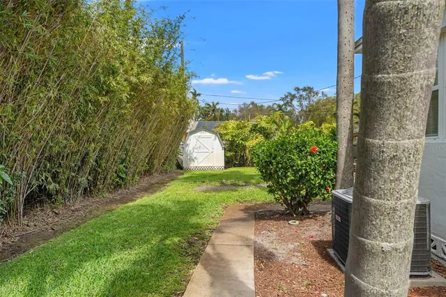 a front view of a house with garden and porch
