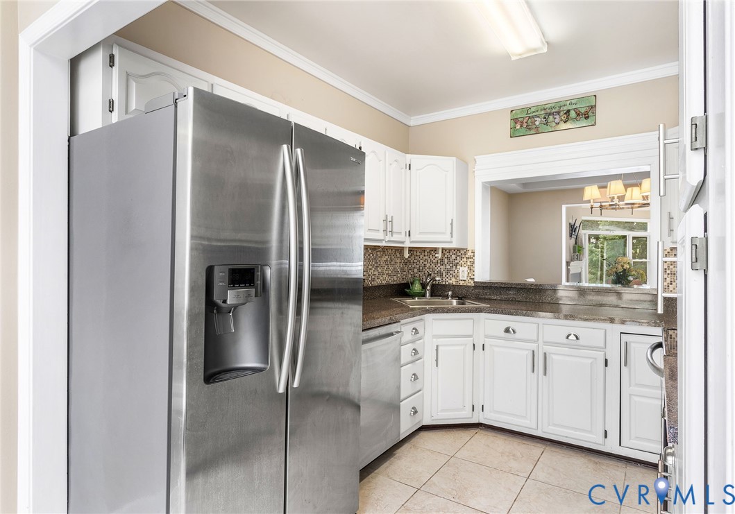 318 Water Pointe Lane Midlothian, VA 23112 - Photo 11 of 36 a kitchen with stainless steel appliances granite countertop a refrigerator and a sink