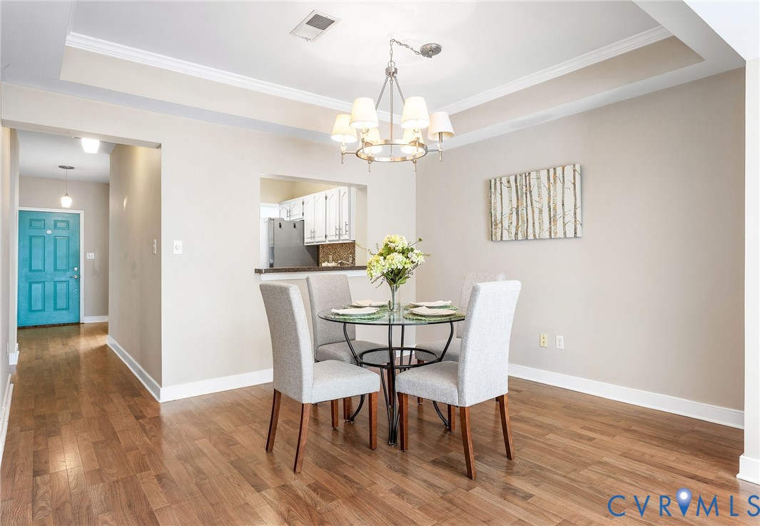 318 Water Pointe Lane Midlothian, VA 23112 - Photo 12 of 50 a view of a dining room with furniture a chandelier and wooden floor