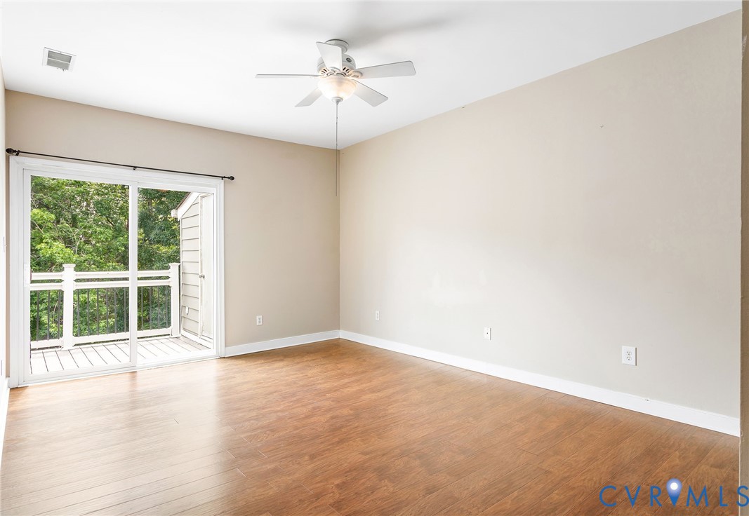318 Water Pointe Lane Midlothian, VA 23112 - Photo 17 of 50 an empty room with wooden floor and windows