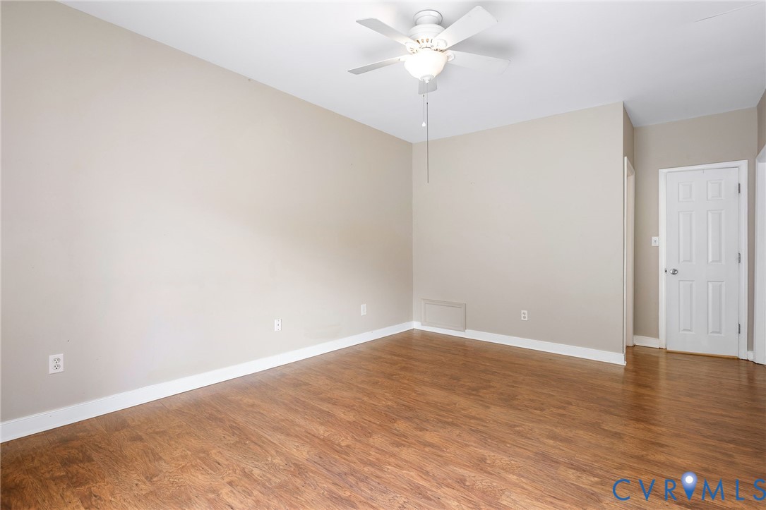 318 Water Pointe Lane Midlothian, VA 23112 - Photo 18 of 50 an empty room with wooden floor and fan