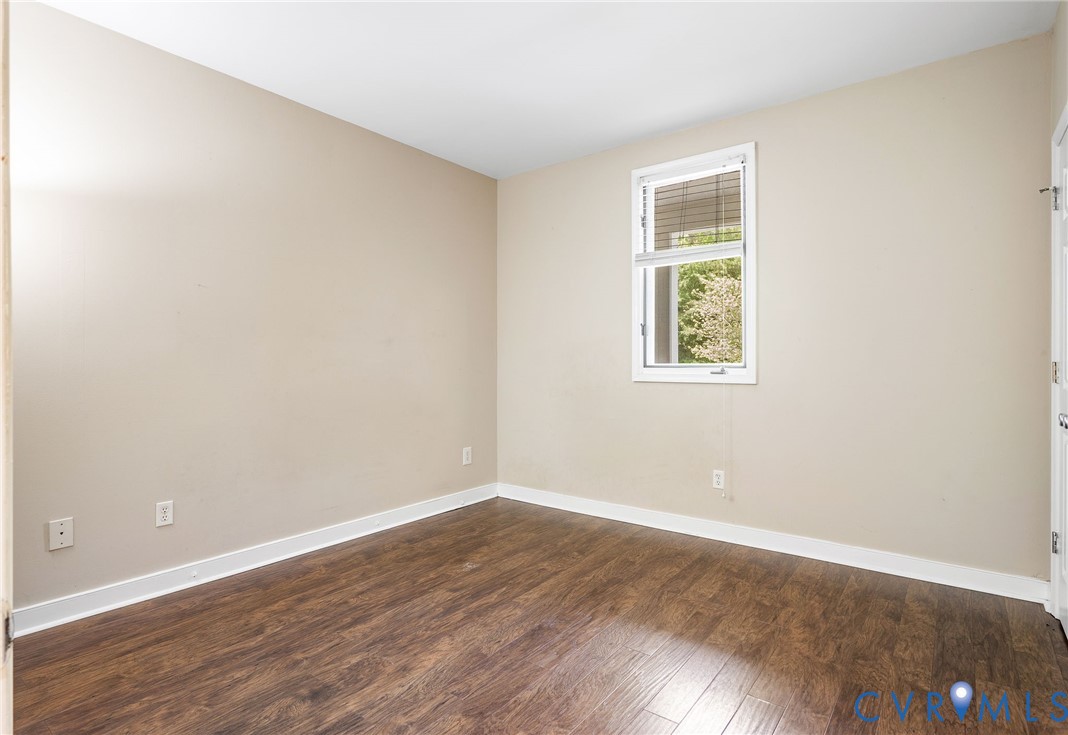 318 Water Pointe Lane Midlothian, VA 23112 - Photo 22 of 50 an empty room with wooden floor and windows