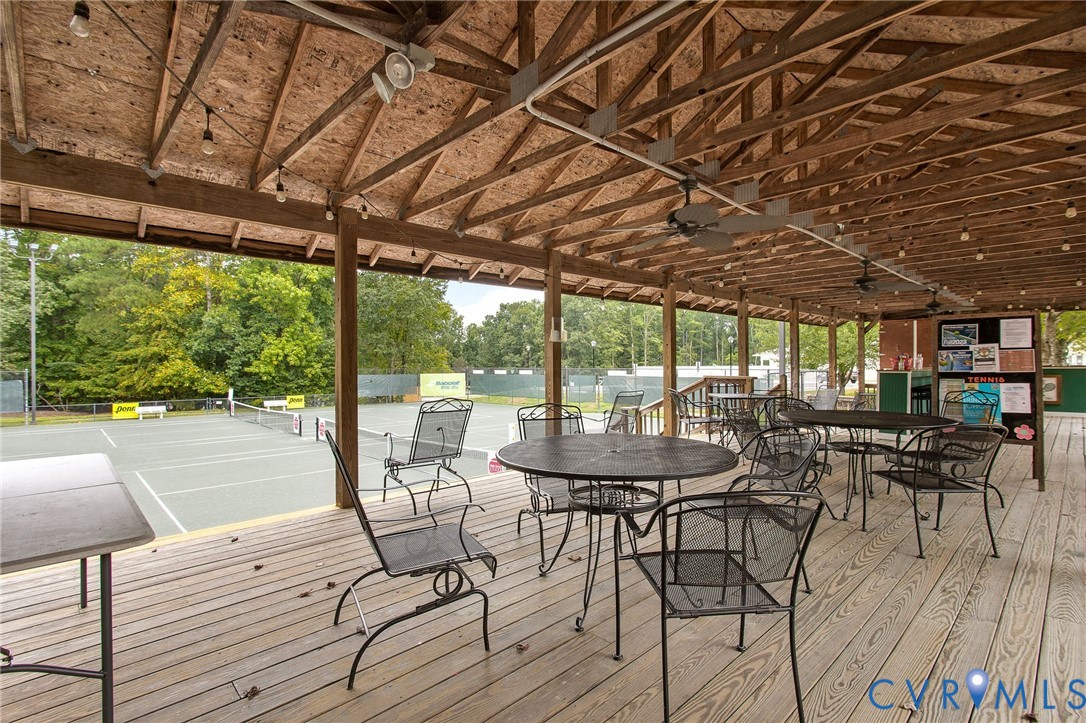 318 Water Pointe Lane Midlothian, VA 23112 - Photo 49 of 50 a view of a patio with a table chairs and a wooden floor