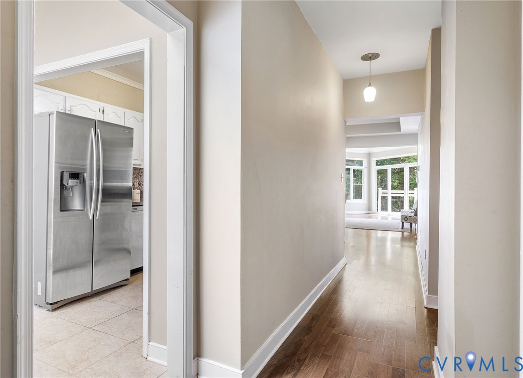 318 Water Pointe Lane Midlothian, VA 23112 - Photo 7 of 50 a view of a hallway with wooden floor and a bathroom