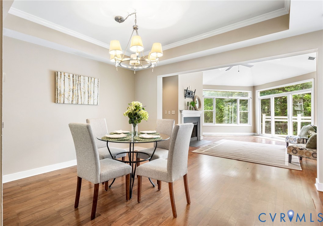 318 Water Pointe Lane Midlothian, VA 23112 - Photo 8 of 50 a view of a dining room with furniture a chandelier and wooden floor