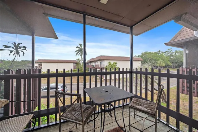 a view of a balcony with furniture