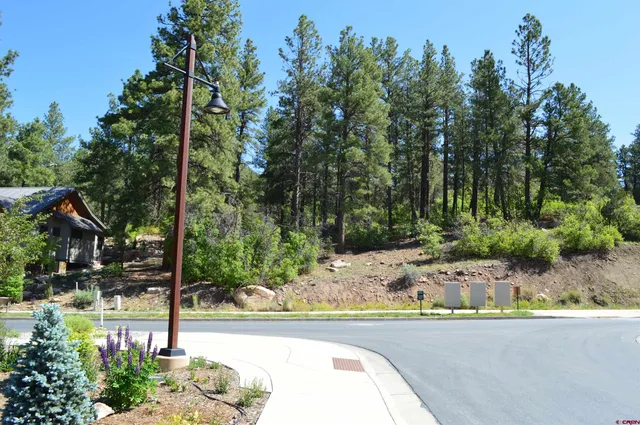 a view of a swimming pool and a bench in the patio