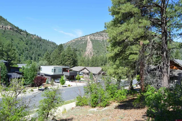 a view of a backyard with sitting area