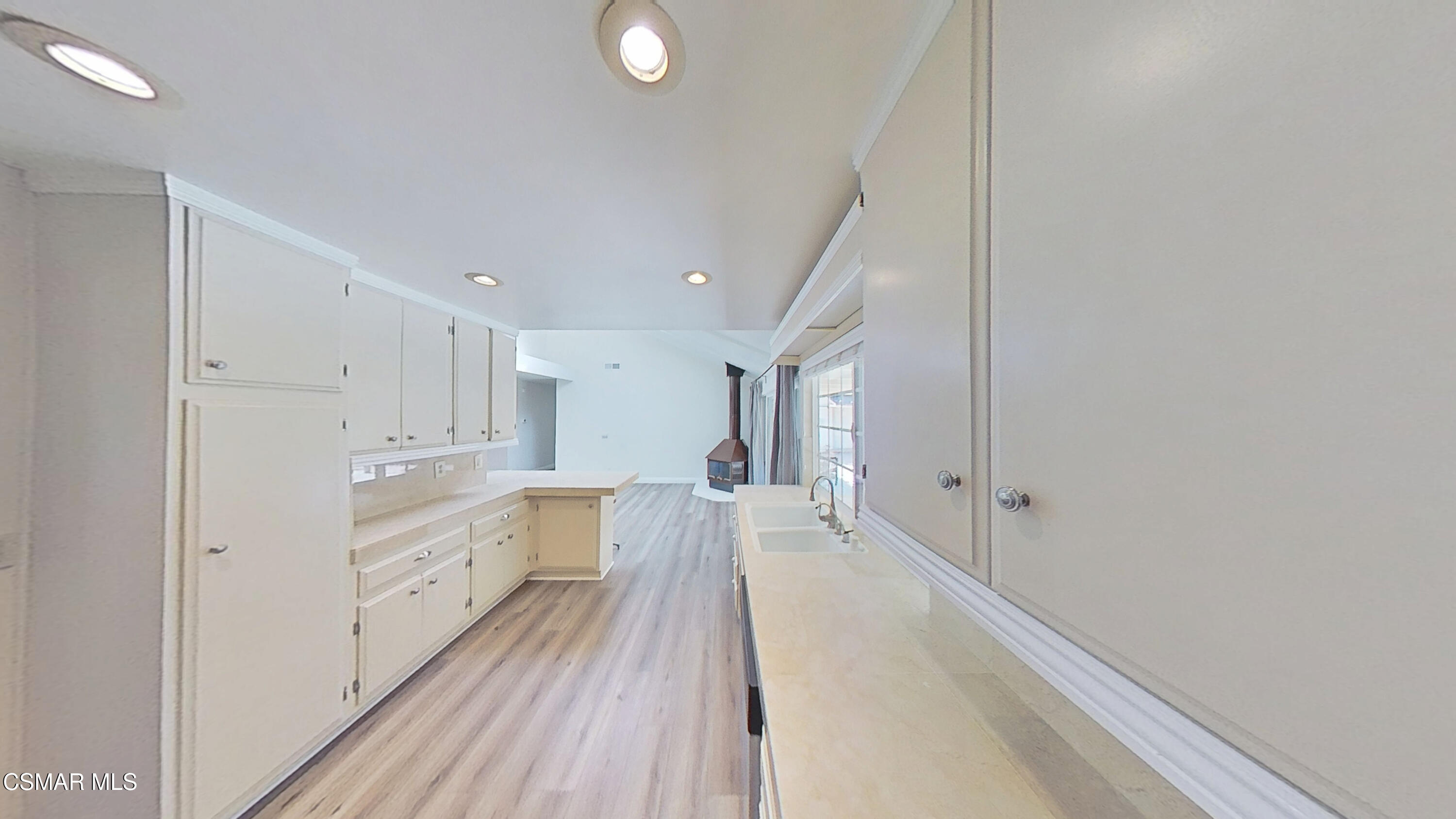 652 Harper Street Simi Valley, CA 93065 - Photo 13 of 30 a view of a kitchen with wooden floor