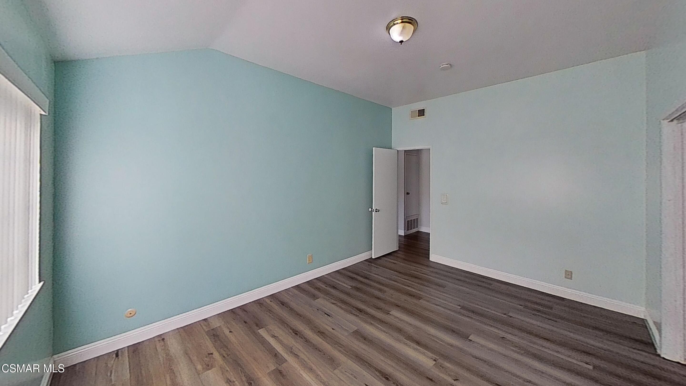 652 Harper Street Simi Valley, CA 93065 - Photo 16 of 30 a view of an empty room with wooden floor