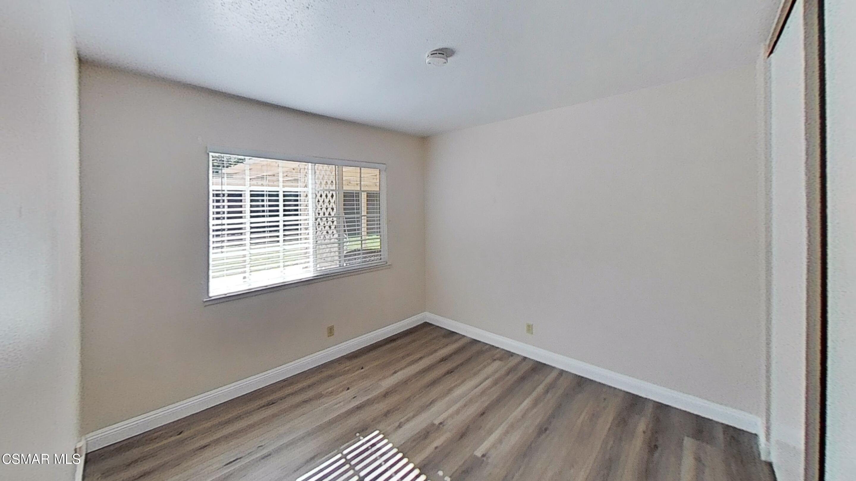652 Harper Street Simi Valley, CA 93065 - Photo 20 of 30 a view of a room with wooden floor and windows