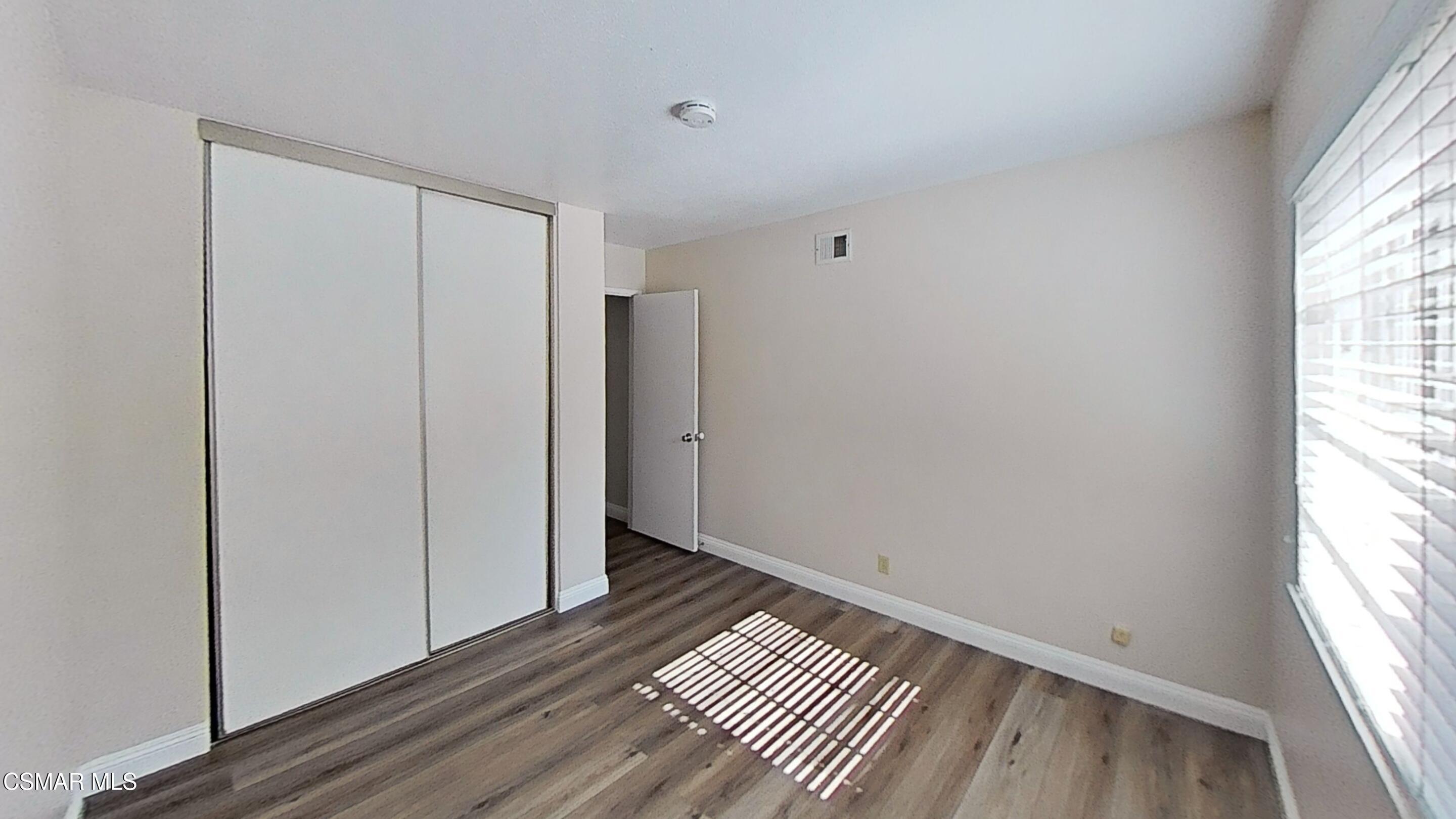 652 Harper Street Simi Valley, CA 93065 - Photo 21 of 30 a view of a room with wooden floor and window