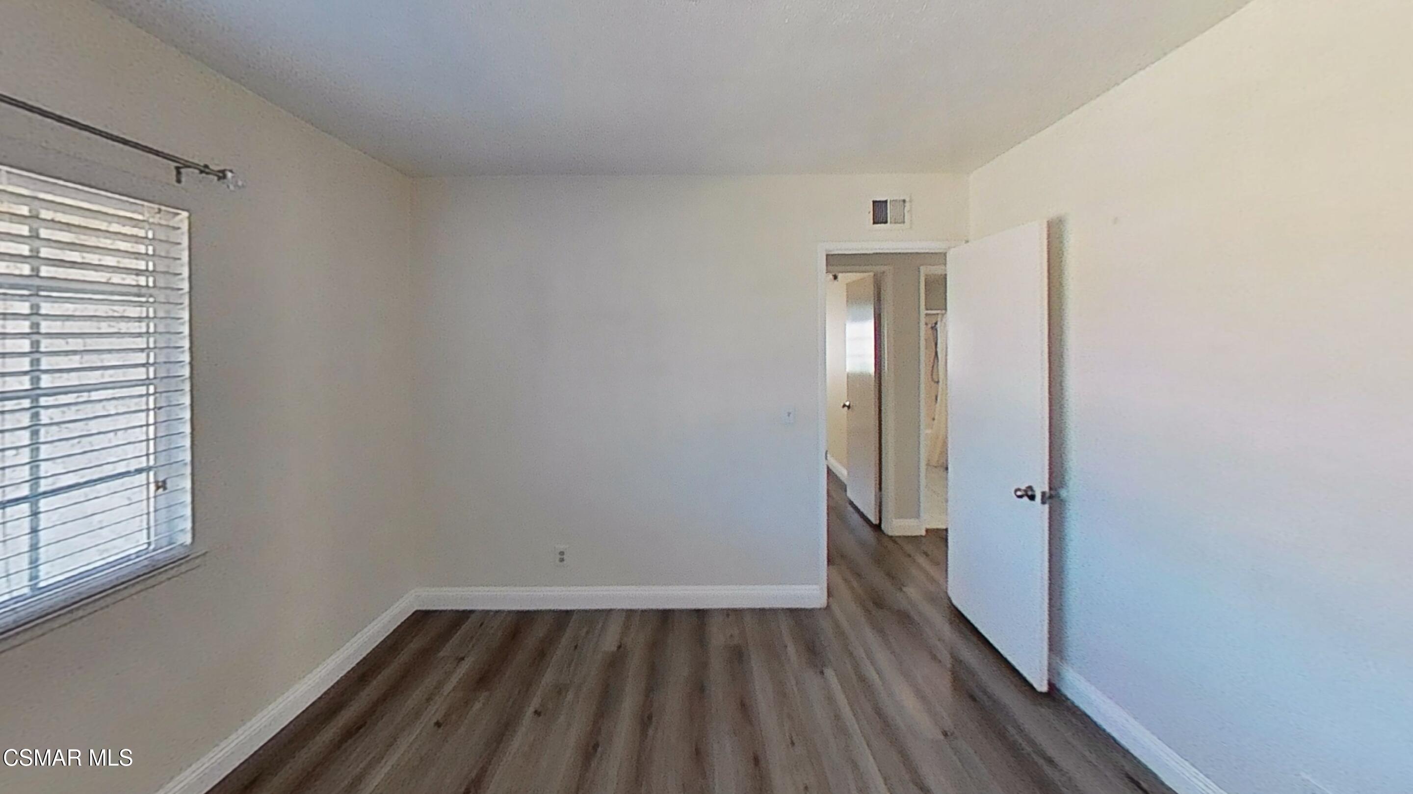 652 Harper Street Simi Valley, CA 93065 - Photo 22 of 30 a view of a room with wooden floor and a window