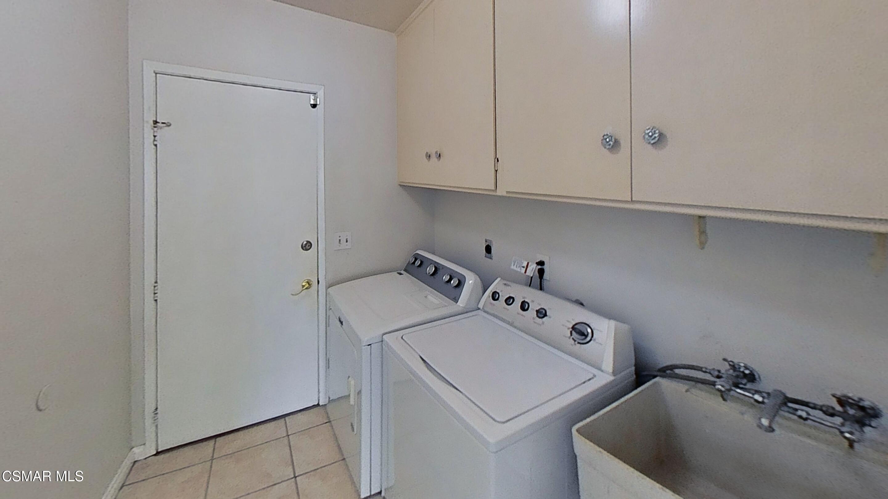 652 Harper Street Simi Valley, CA 93065 - Photo 26 of 30 a utility room with dryer and washer