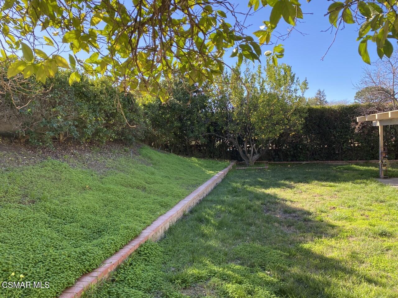 652 Harper Street Simi Valley, CA 93065 - Photo 10 of 30 a view of a backyard with a small park