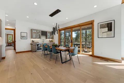 a view of a dining room with furniture window and outside view