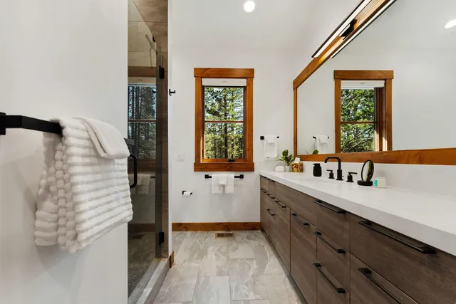 a large white kitchen with a window