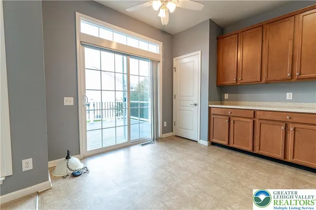 a view of a kitchen with dishwasher and cabinets