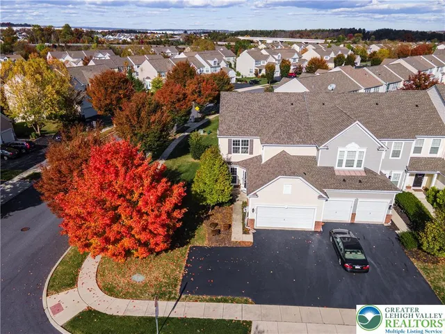 an aerial view of a house with a swimming pool