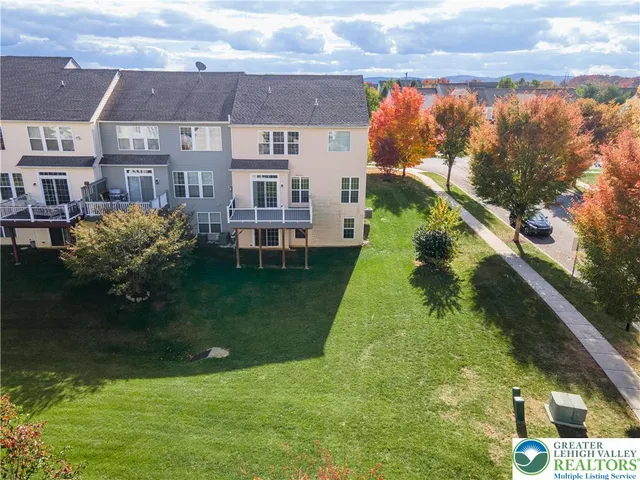 a aerial view of a house with a yard