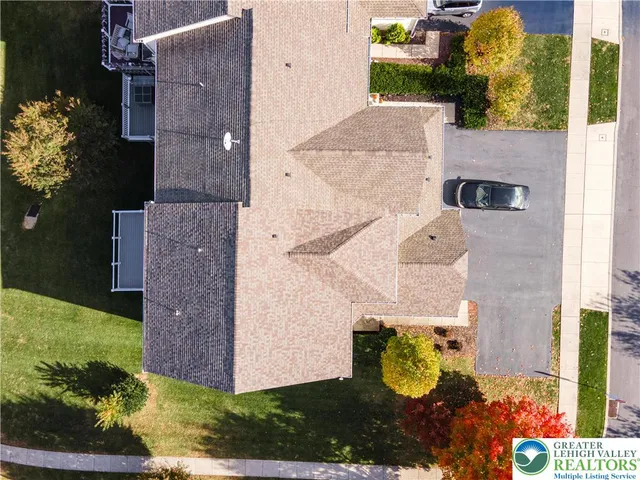 aerial view of a house with a yard