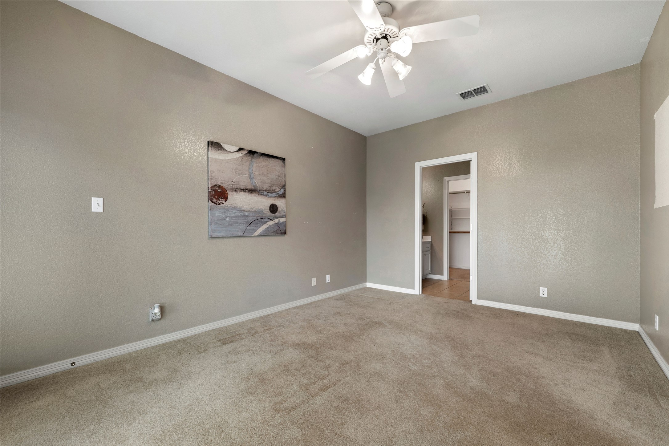 1005 East Buttercup Road Taylor, TX 76574 - Photo 17 of 38 an empty room with fan and windows