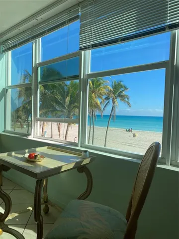 a room with two chairs and a window