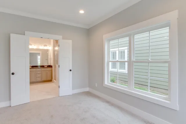 a view of a kitchen with a sink and a large window