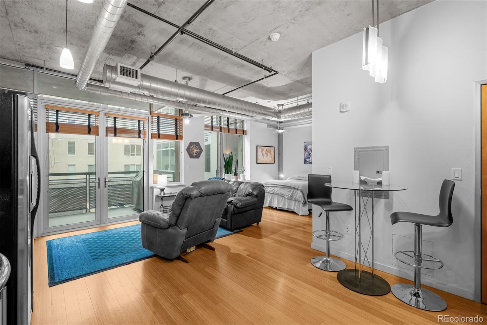 1401 Wewatta Street, Unit 311 Denver, CO 80202 - Photo 14 of 34 a living room with furniture