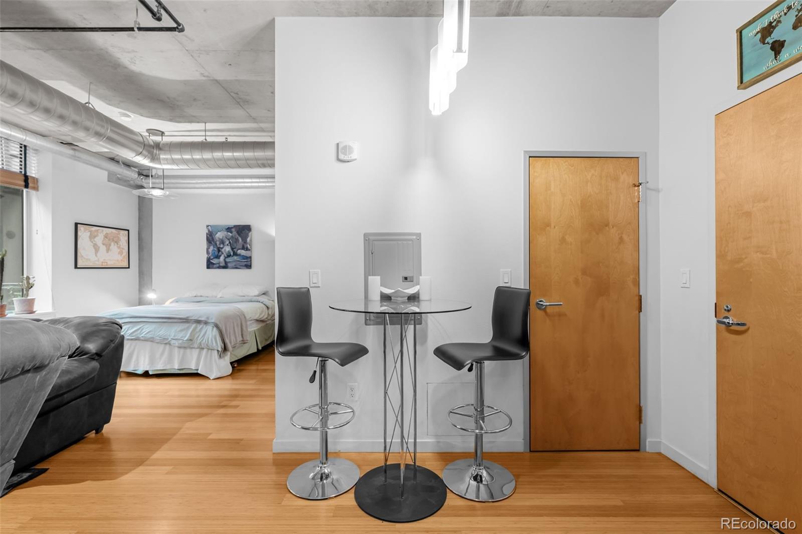 1401 Wewatta Street, Unit 311 Denver, CO 80202 - Photo 15 of 34 a living room with furniture and a table