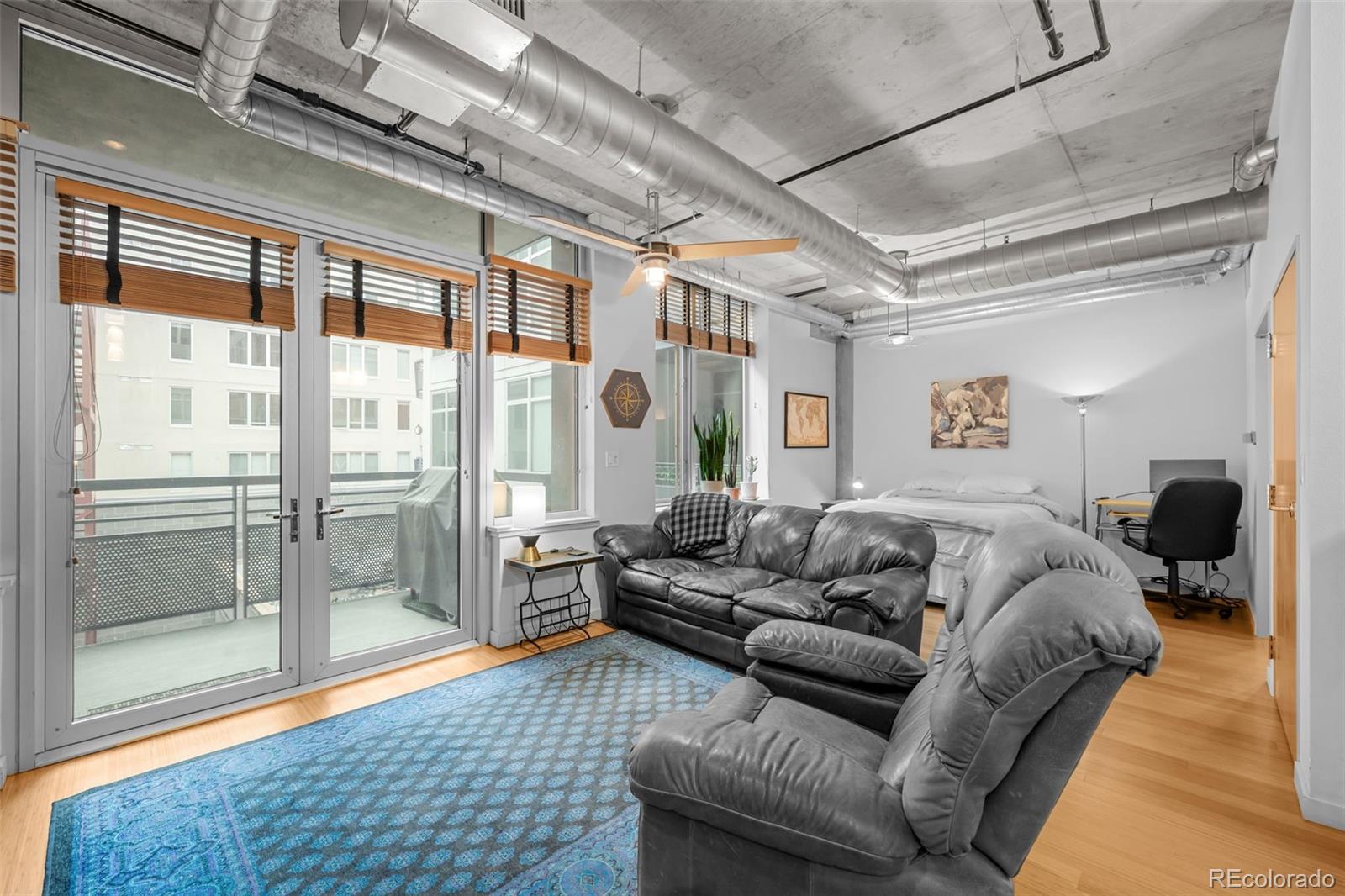 1401 Wewatta Street, Unit 311 Denver, CO 80202 - Photo 16 of 34 a living room with furniture