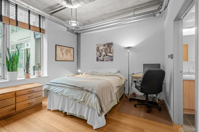 a bedroom with a bed and furniture