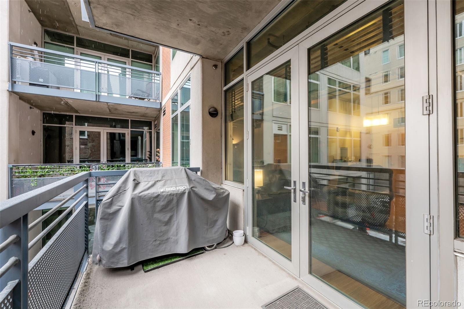 1401 Wewatta Street, Unit 311 Denver, CO 80202 - Photo 29 of 34 a spacious bathroom with a glass door shower and sink