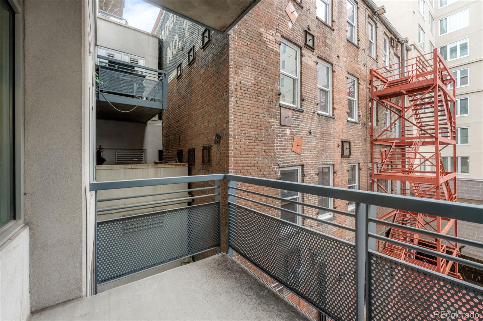 1401 Wewatta Street, Unit 311 Denver, CO 80202 - Photo 30 of 34 a view of a building from a balcony