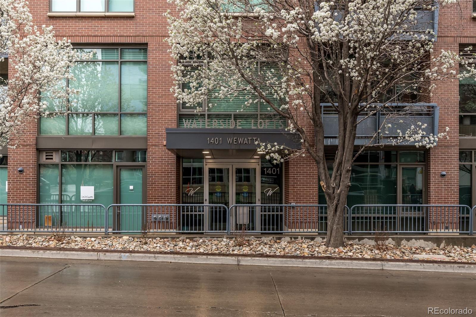 1401 Wewatta Street, Unit 311 Denver, CO 80202 - Photo 6 of 34 front view of a building with a street