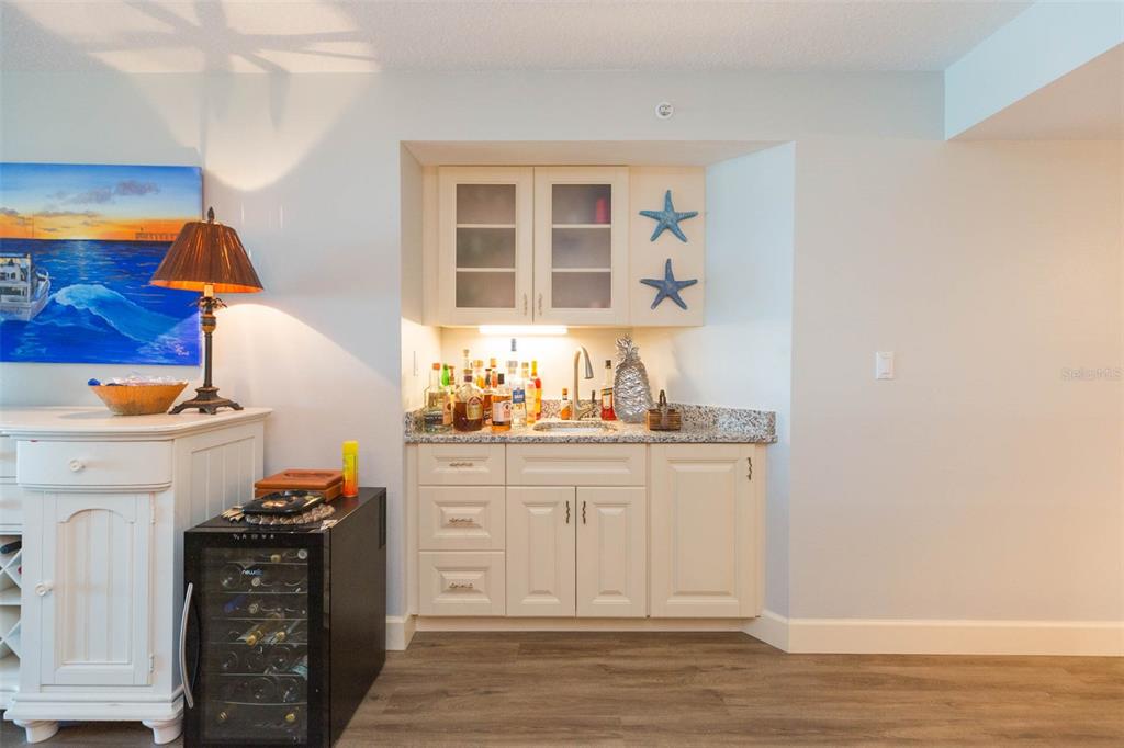 16326 Gulf Boulevard, Unit 109 Redington Beach, FL 33708 - Photo 12 of 63 a kitchen with stainless steel appliances granite countertop a stove and a sink