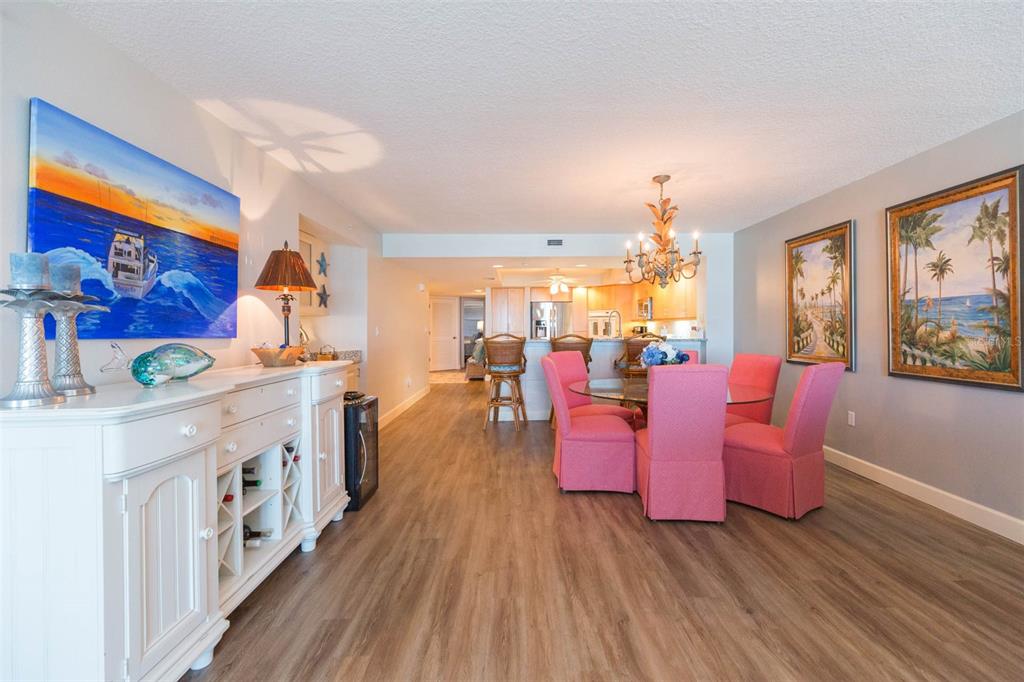 16326 Gulf Boulevard, Unit 109 Redington Beach, FL 33708 - Photo 14 of 63 a large living room with stainless steel appliances kitchen island hardwood floor and a large window