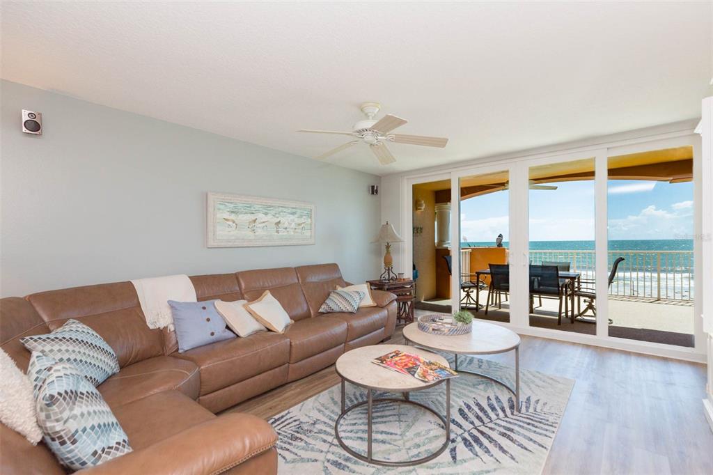 16326 Gulf Boulevard, Unit 109 Redington Beach, FL 33708 - Photo 15 of 63 a living room with furniture and a large window