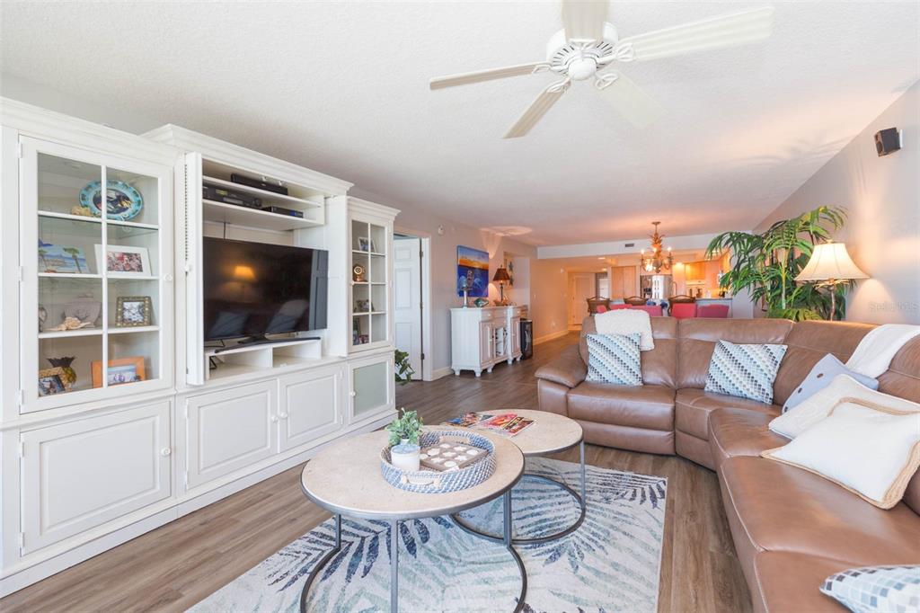 16326 Gulf Boulevard, Unit 109 Redington Beach, FL 33708 - Photo 16 of 63 a living room with furniture a flat screen tv and a dining table