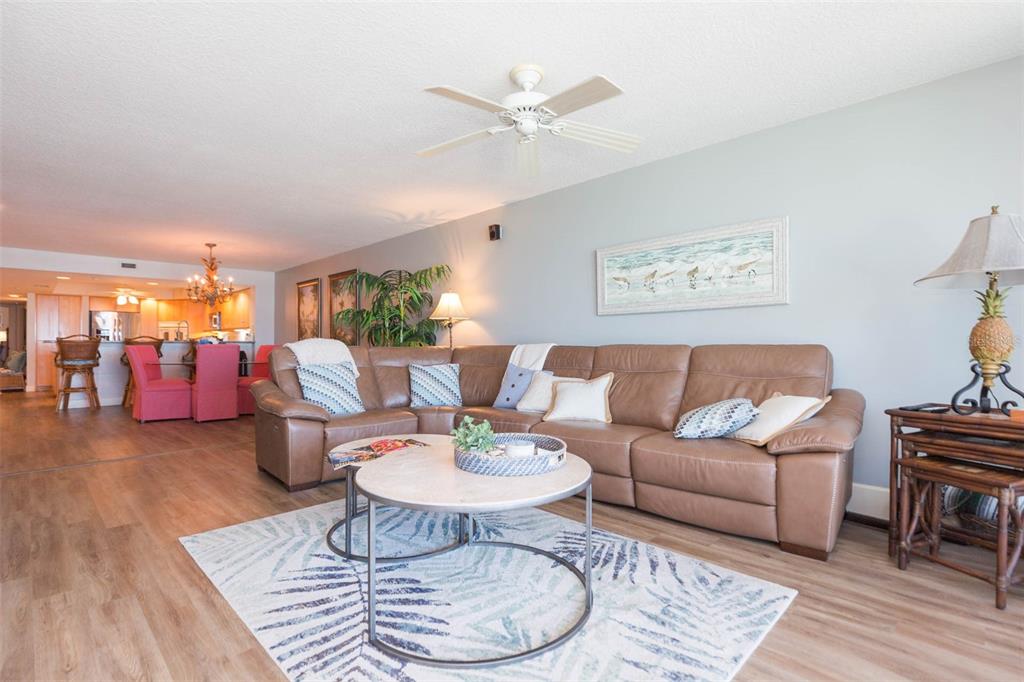 16326 Gulf Boulevard, Unit 109 Redington Beach, FL 33708 - Photo 18 of 63 a living room with furniture and wooden floor