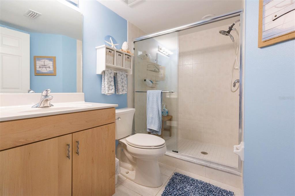 16326 Gulf Boulevard, Unit 109 Redington Beach, FL 33708 - Photo 23 of 63 a bathroom with a sink toilet and shower