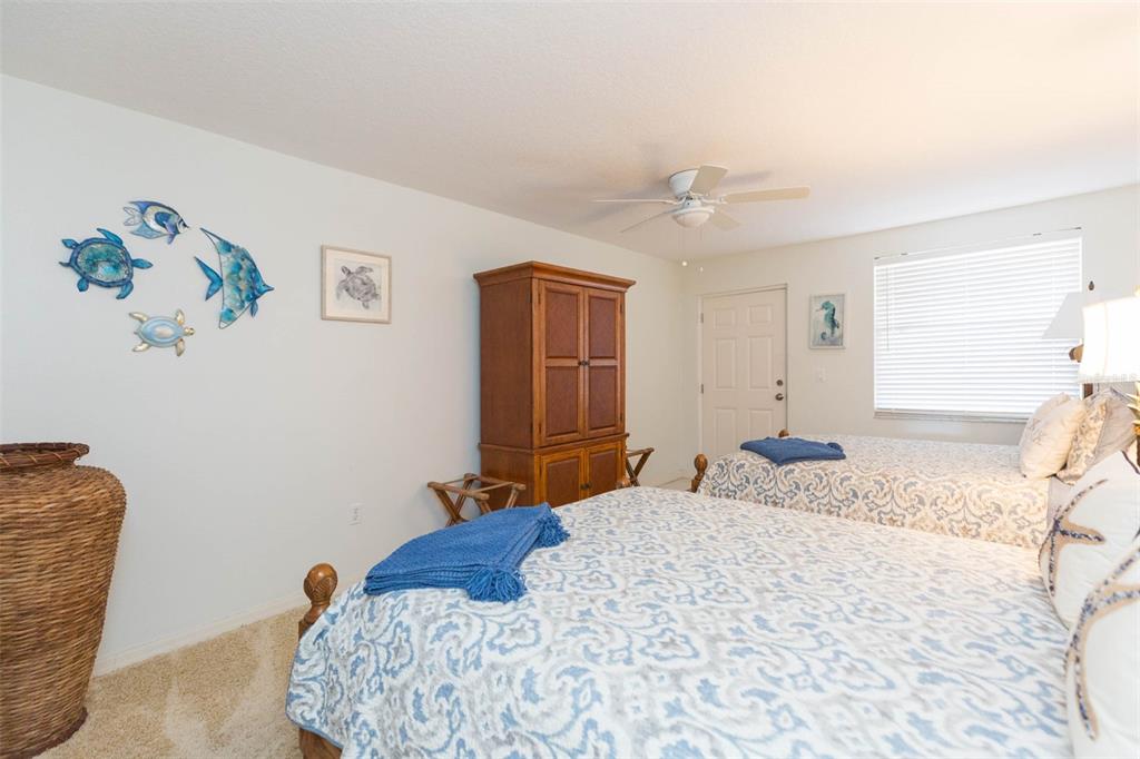 16326 Gulf Boulevard, Unit 109 Redington Beach, FL 33708 - Photo 24 of 63 a bedroom with a bed and a window