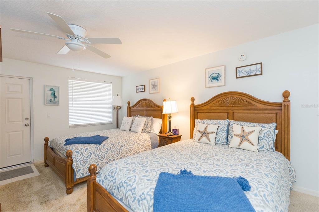 16326 Gulf Boulevard, Unit 109 Redington Beach, FL 33708 - Photo 25 of 63 a bedroom with a bed and window