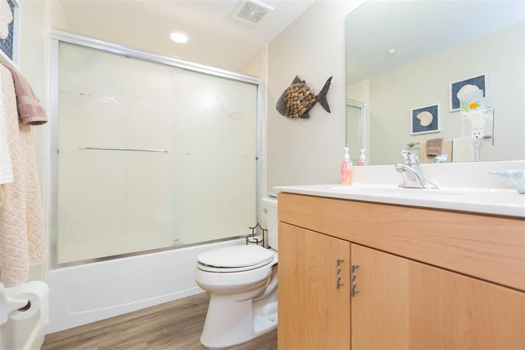 16326 Gulf Boulevard, Unit 109 Redington Beach, FL 33708 - Photo 28 of 63 a bathroom with a sink and a mirror