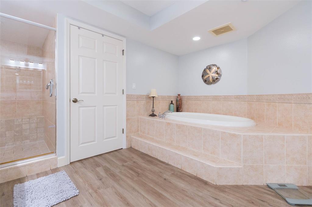16326 Gulf Boulevard, Unit 109 Redington Beach, FL 33708 - Photo 40 of 63 a spacious bathroom with a bathtub and a shower