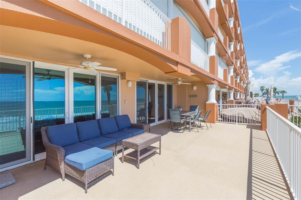 16326 Gulf Boulevard, Unit 109 Redington Beach, FL 33708 - Photo 42 of 63 a outdoor living space with patio furniture and a potted plant