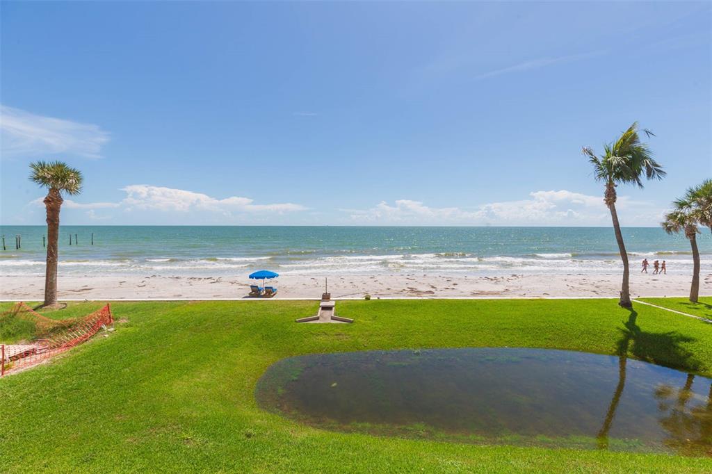 16326 Gulf Boulevard, Unit 109 Redington Beach, FL 33708 - Photo 49 of 63 a view of a lake with a big yard