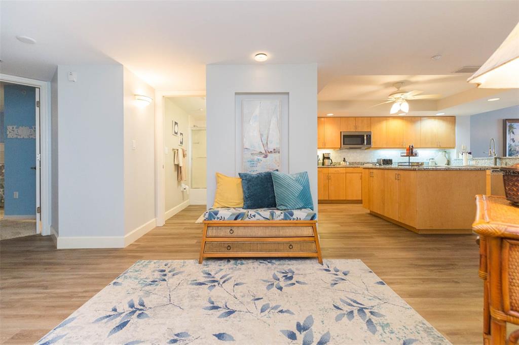 16326 Gulf Boulevard, Unit 109 Redington Beach, FL 33708 - Photo 5 of 63 a living room with furniture and a table